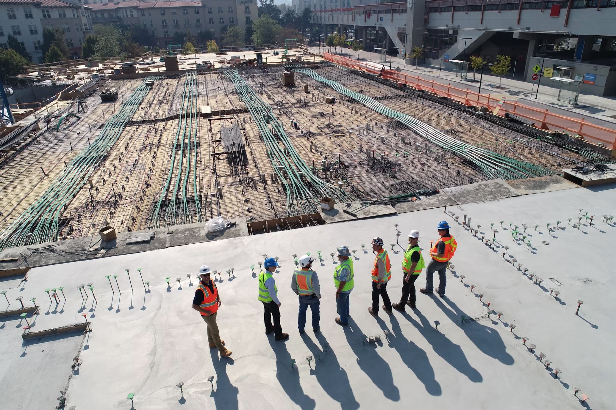 Site team reviewing a major construction platform from above during works
